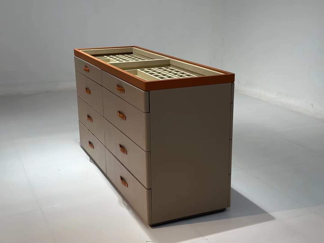 Taupe multi-drawer dresser with copper trim