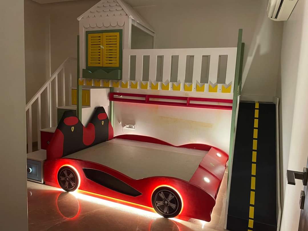 Kids bedroom — Ferrari car bed with racetrack slide