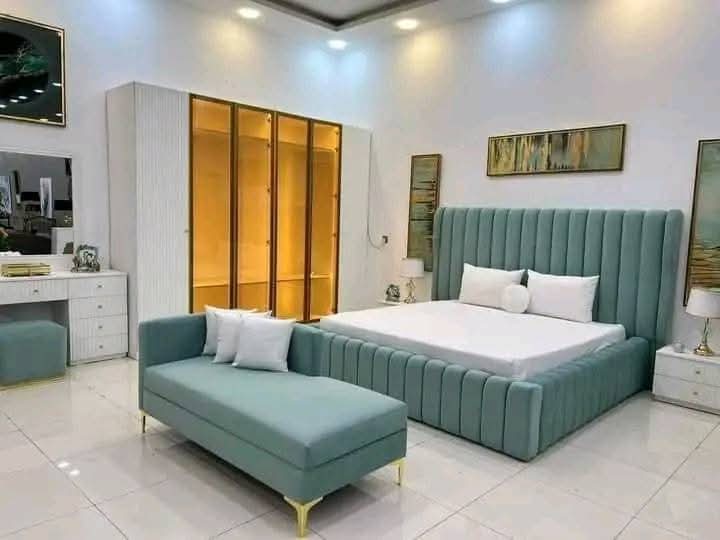 Teal channelled bed with lit wardrobe suite