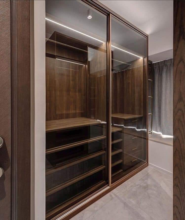 Dark walnut sliding wardrobe with smoked glass