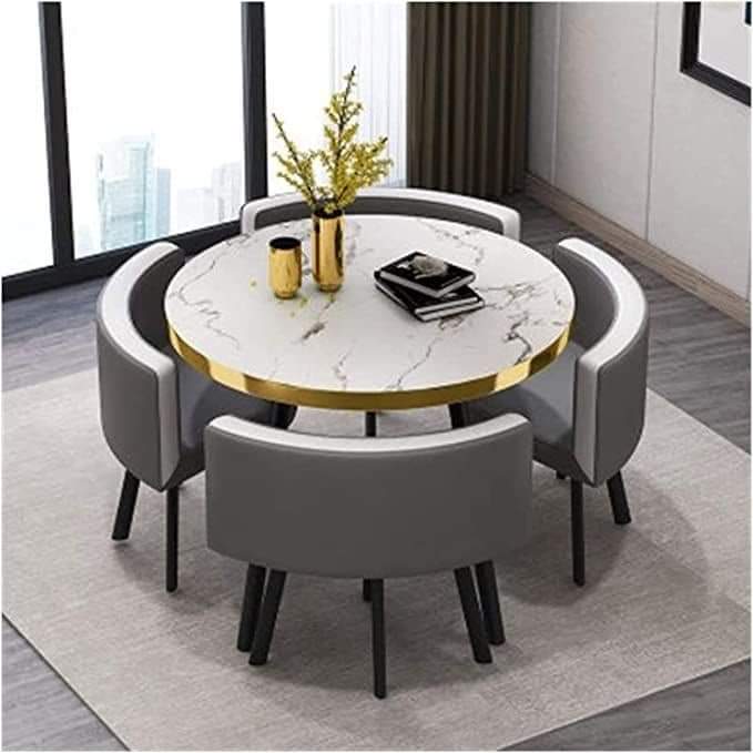Round marble table with gold rim & grey chairs