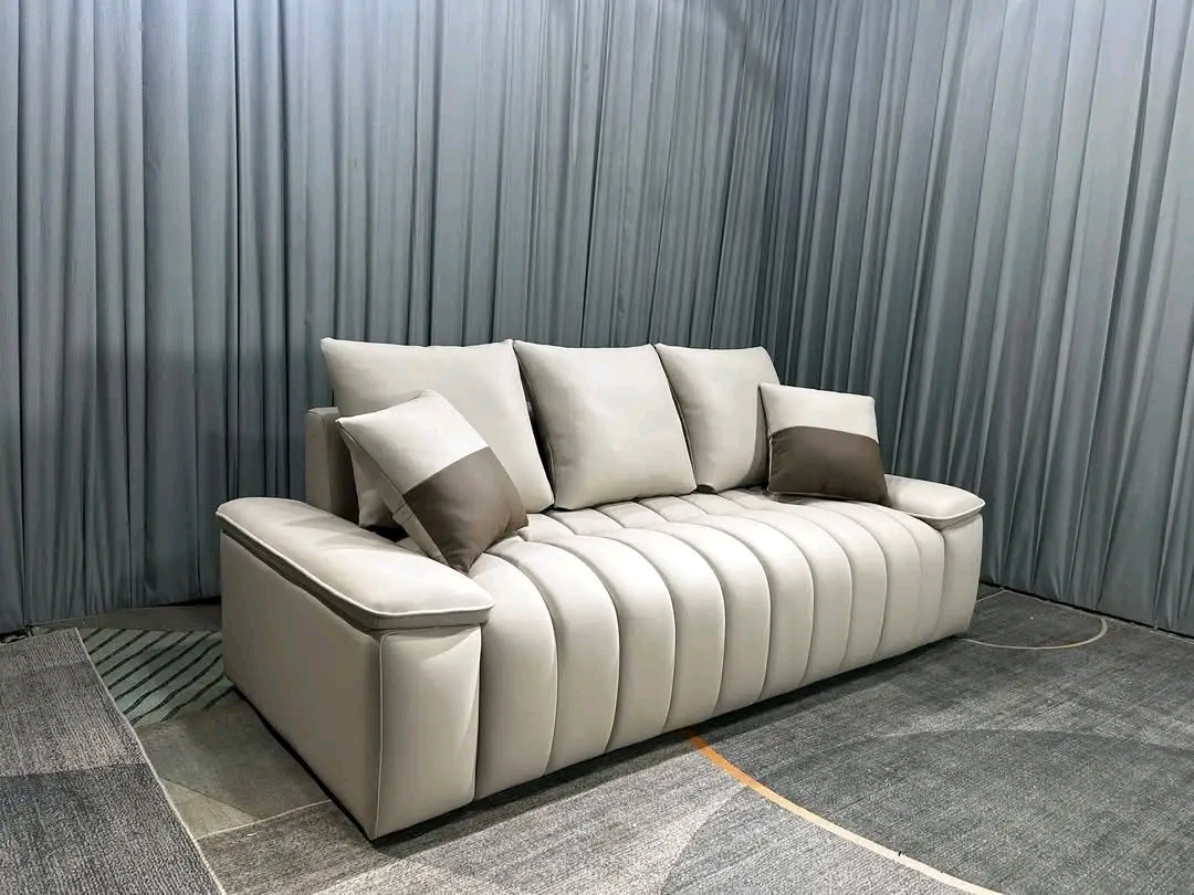 Cream channel sofa — plush quilted back