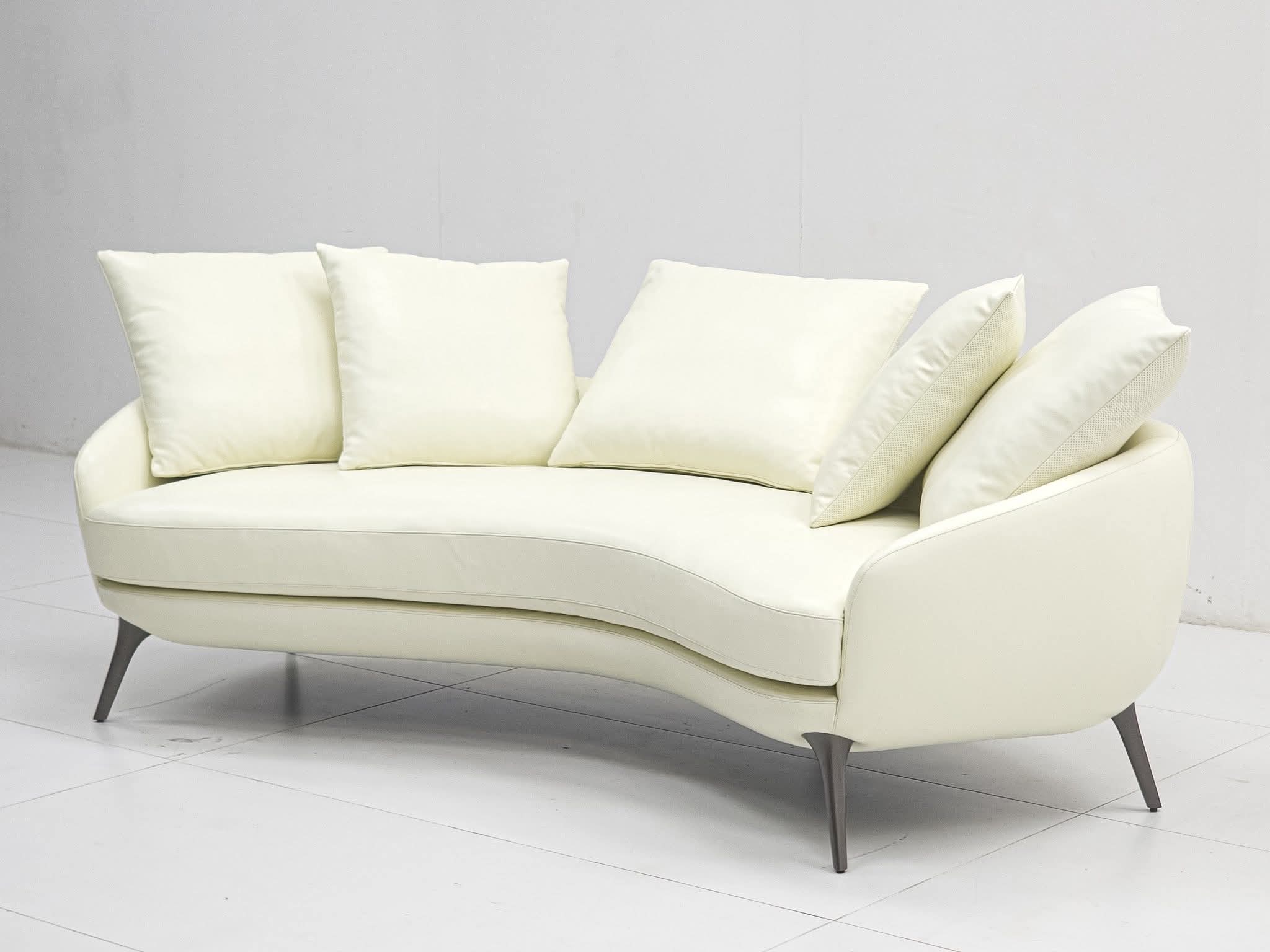 Cream curved sofa — elegant wingback shape