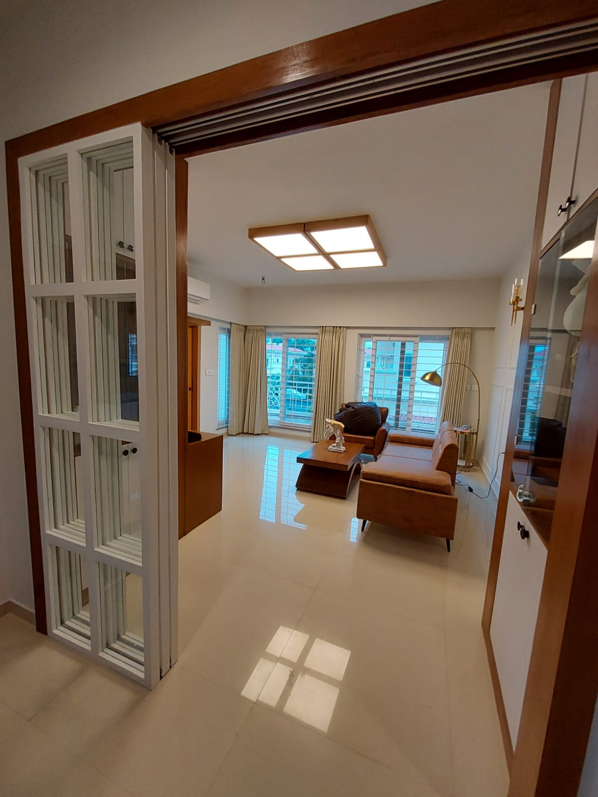 Tan leather sofa in a bright spacious room
