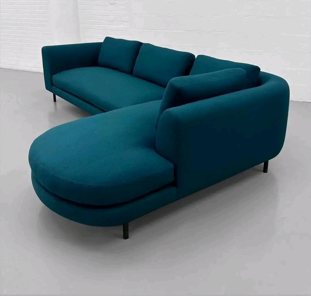Teal L-shaped sectional with round chaise